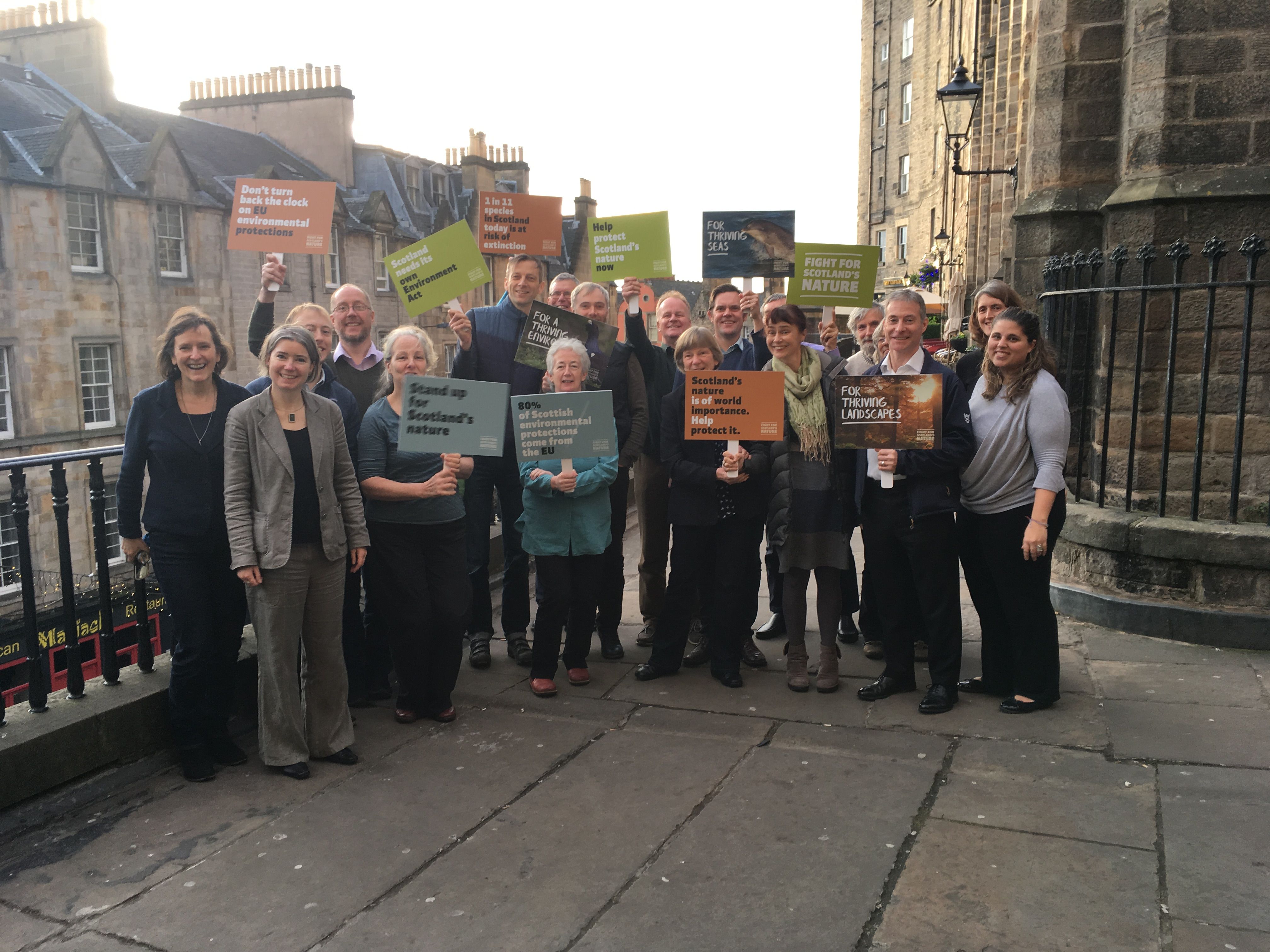 This is an image of Scotlink members with banners outside in Edinburgh