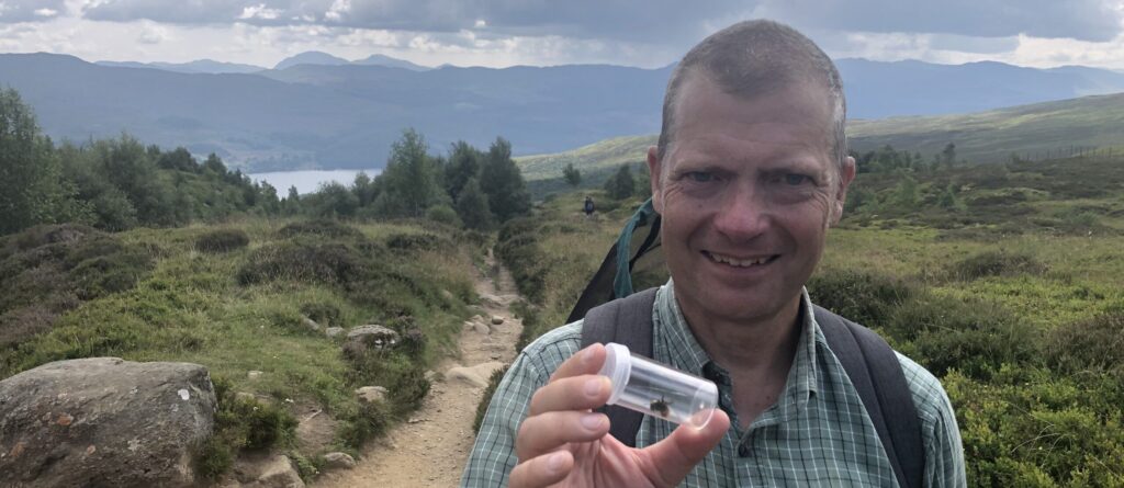 Graham Simpson MSP, Nature Champion for the Ash tree and the Bilberry Bumblebee, picture with a Bilberry Bumblebee at Ben Lawers NNR. 